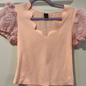 Scalloped neck top with sheer short a sleeves. Apricot pink